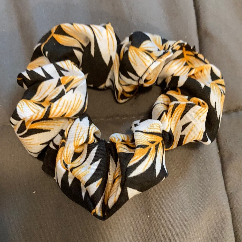 black scrunchie with yellow and white flowers
